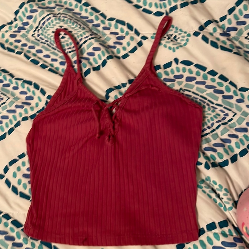 tank top crop top is a little lighter pink than in the picture but still cute